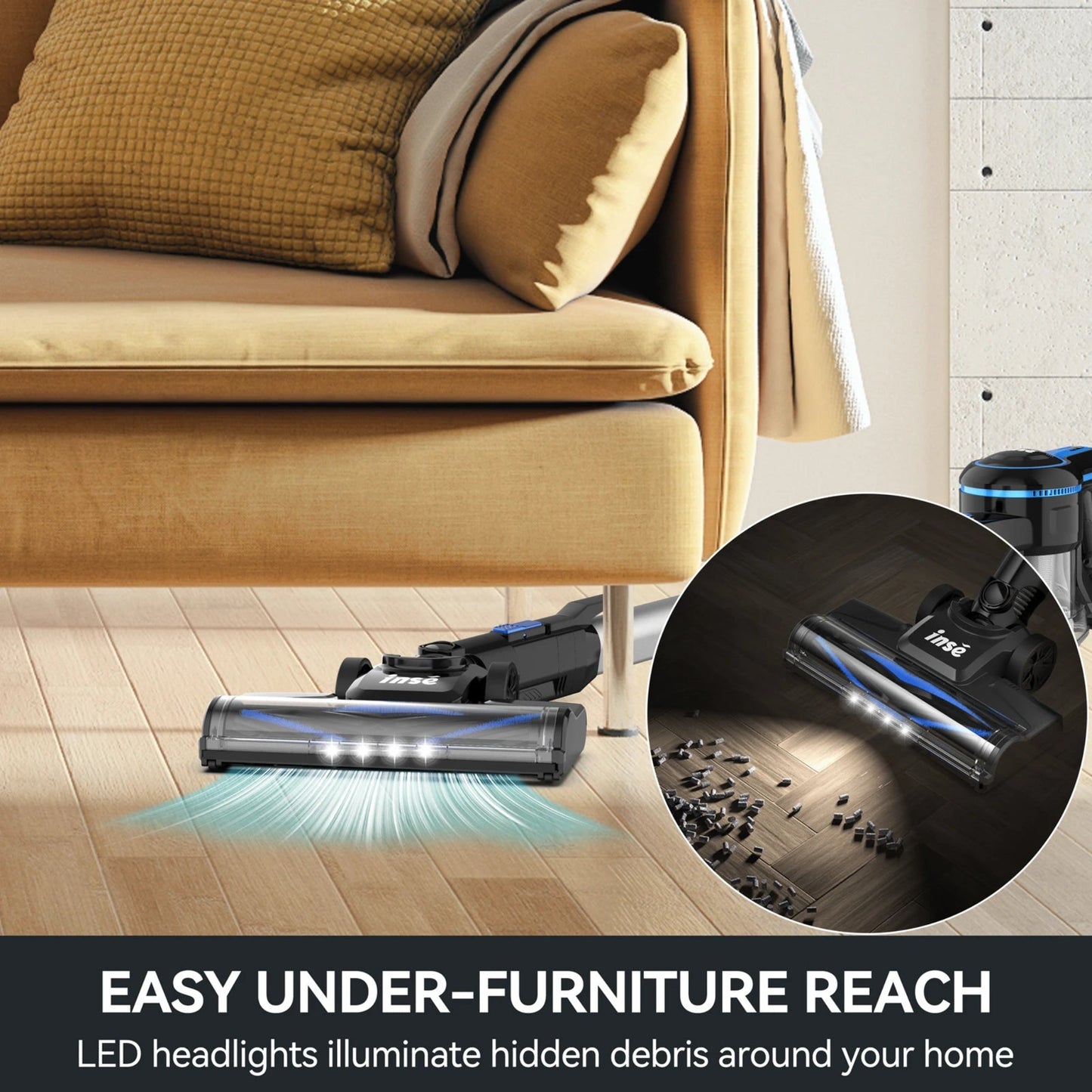Vacuum cleaner with LED headlights on a wooden floor next to a couch, highlighting its ability to reach under furniture.