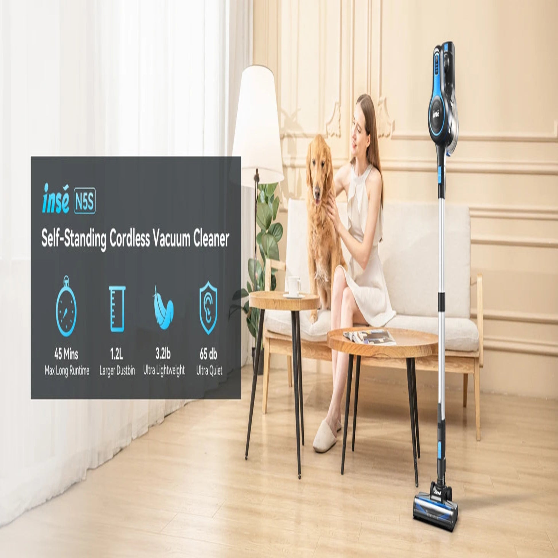 Woman sitting on a couch with a dog next to an INSE self-standing cordless vacuum cleaner in a living room.