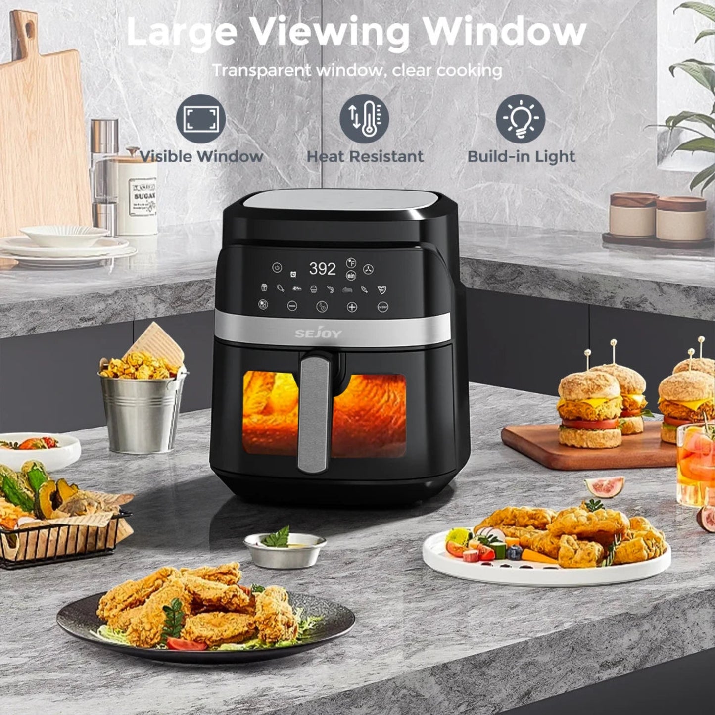 Black air fryer with food items on a kitchen counter, highlighting features like a large viewing window.